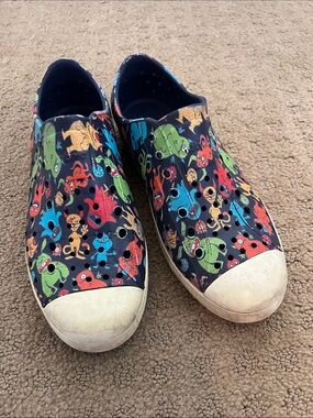 Native Kids Slip-On Shoes in Black with Multicolor Monster Print